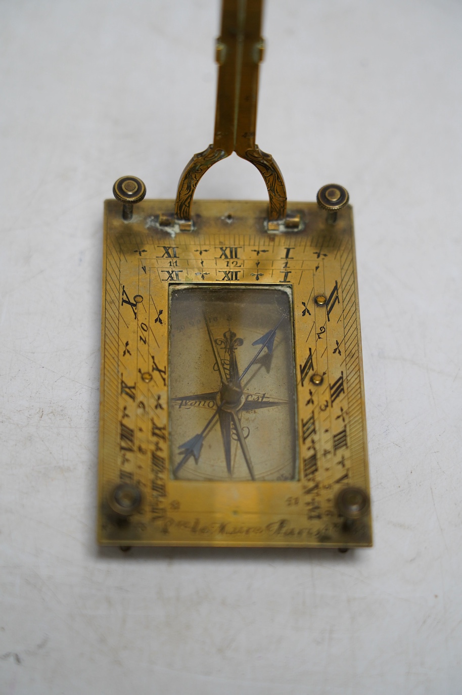 Pierre Le Maire, a French engraved brass pocket sundial with compass, late 18th century. Condition - fair